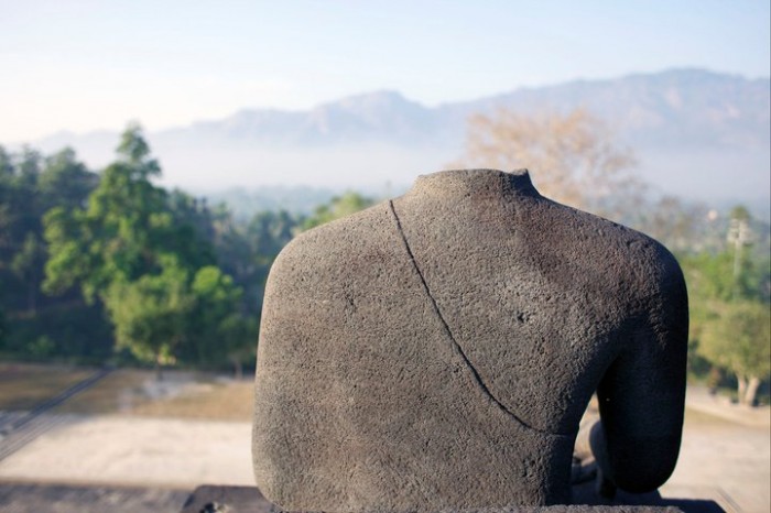 A headless sculpture at the Borobudur temple, outside of Yogyakarta, Indonesia.