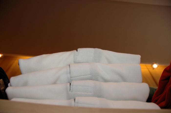 Photo Caption: Stack of White Polo Shirts by 2Tales on Flickr