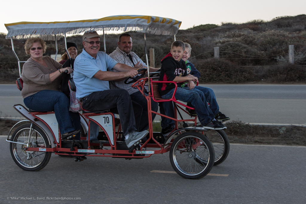 Photo credit: Smiling family of six peddle 4-wheel bike by mikebaird on Flickr